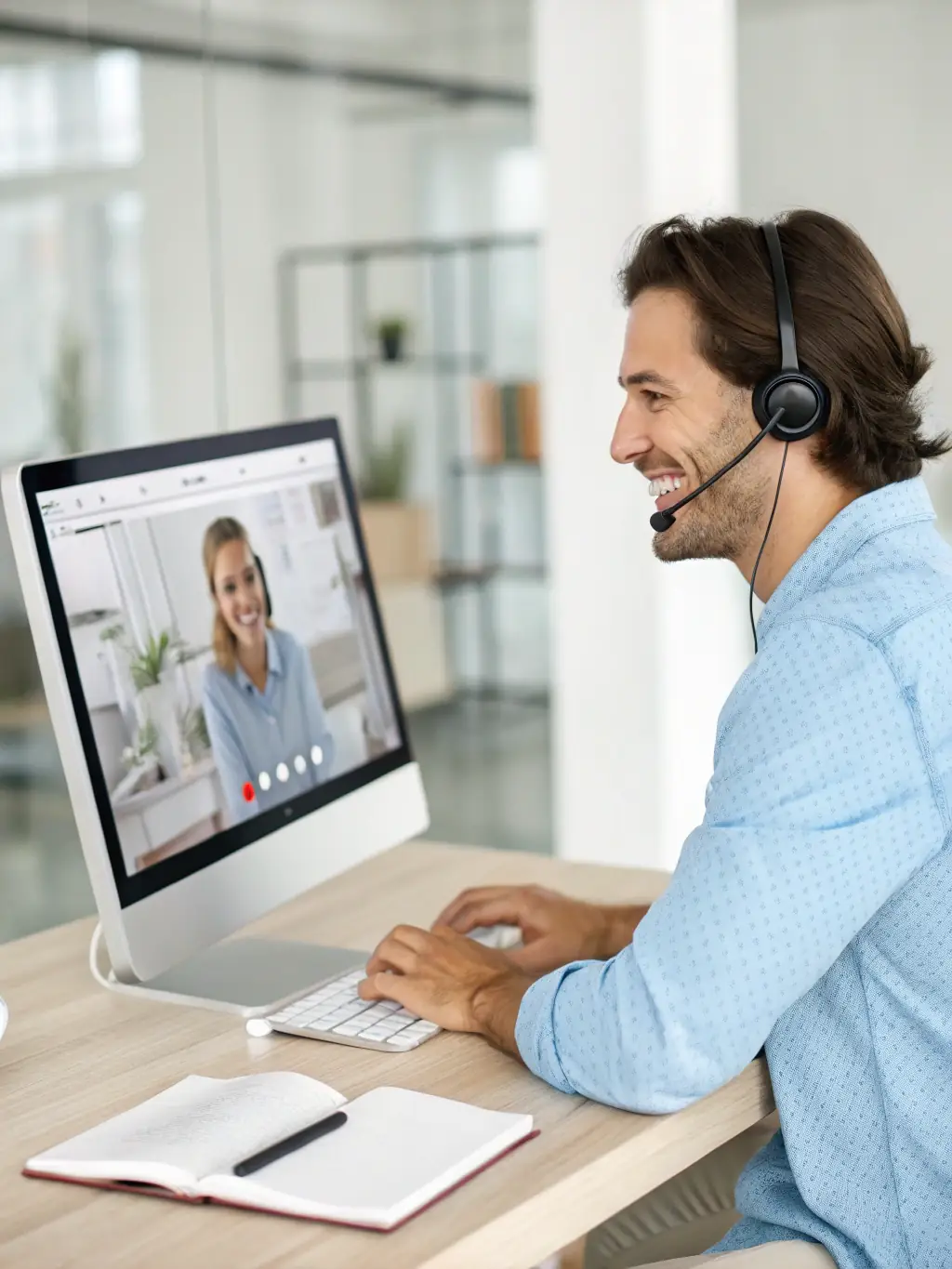 An IT support specialist assisting a small business employee via video call, resolving a software issue quickly and efficiently.